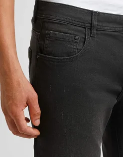 Jeans skinny fit nero con strappi