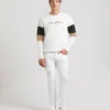Pantaloni cinque tasche in cotone con strappi