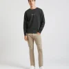 Pantaloni cinque tasche in cotone con strappi