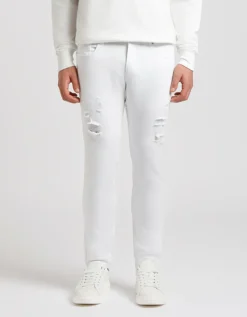Pantaloni cinque tasche in cotone con strappi