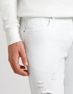 Pantaloni cinque tasche in cotone con strappi