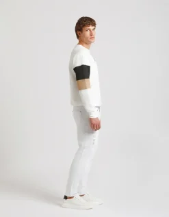 Pantaloni cinque tasche in cotone con strappi