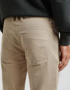 Pantaloni cinque tasche in cotone con strappi